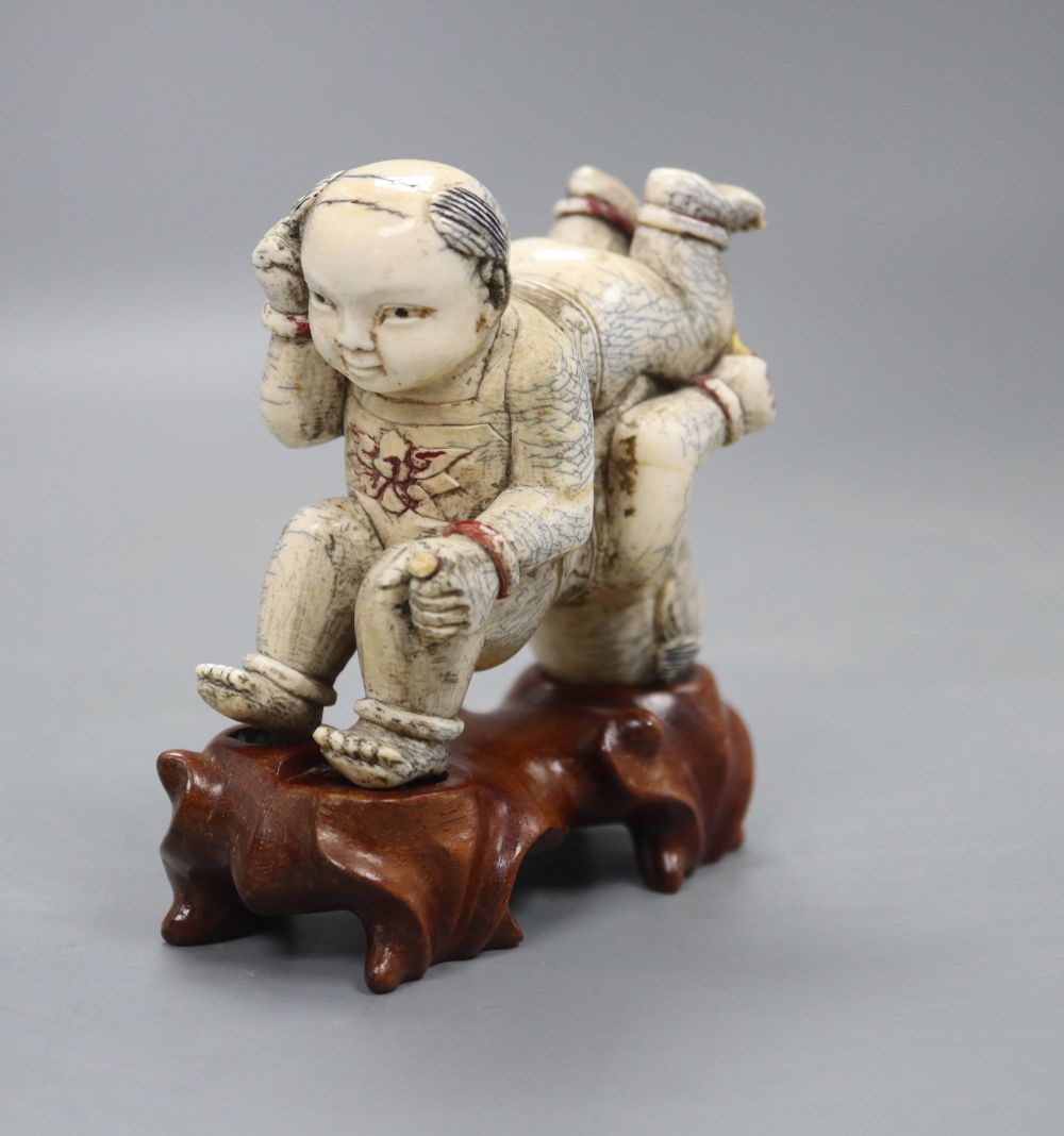 Two Chinese wooden stands (boys), height 9cm